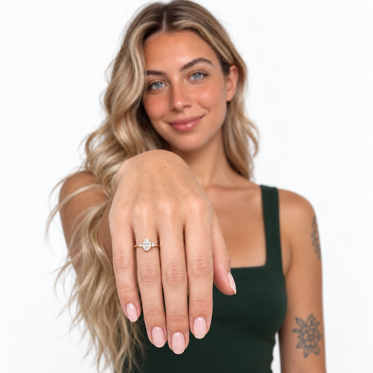 Oval Stone Stacking Ring worn by model with hand extended toward the camera