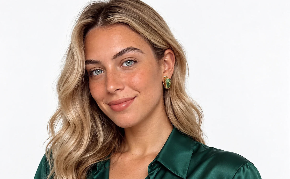 Auricelia jewelry worn in a distinct green outfit