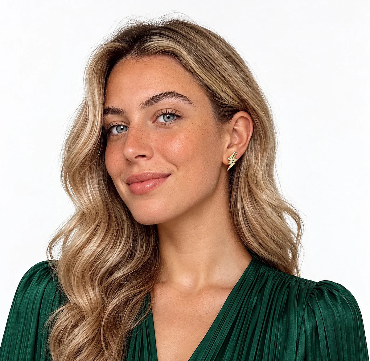 Auricelia jewelry worn in a distinct green outfit