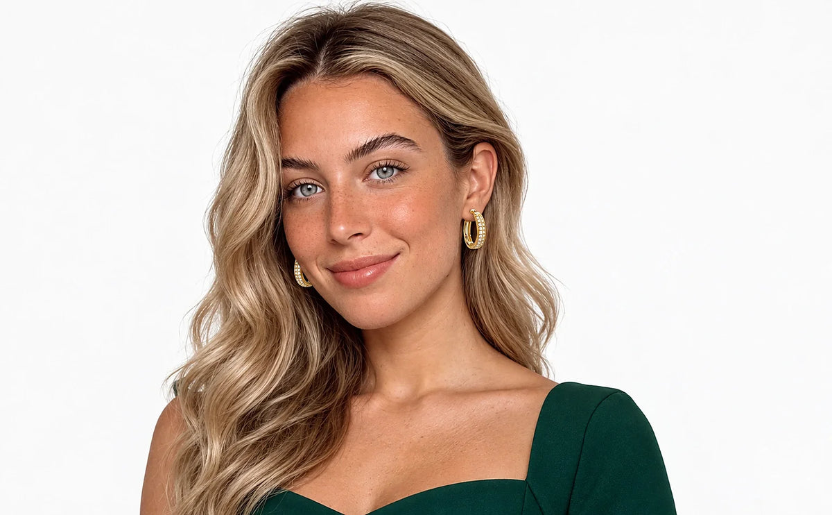 Auricelia jewelry worn in a distinct green outfit