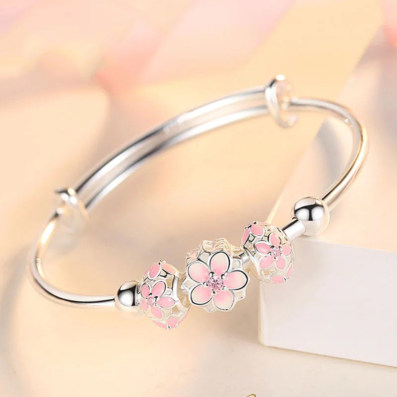 https://ae01.alicdn.com/kf/Sc266bfb18a594fb0b4e7b8f3a75896a78/Silver-Color-Round-Lucky-Bead-Sakura-Snowflake-Dreamcatcher-Charm-bracelets-Bangle-for-women-bracelet-Elegant-love.jpg