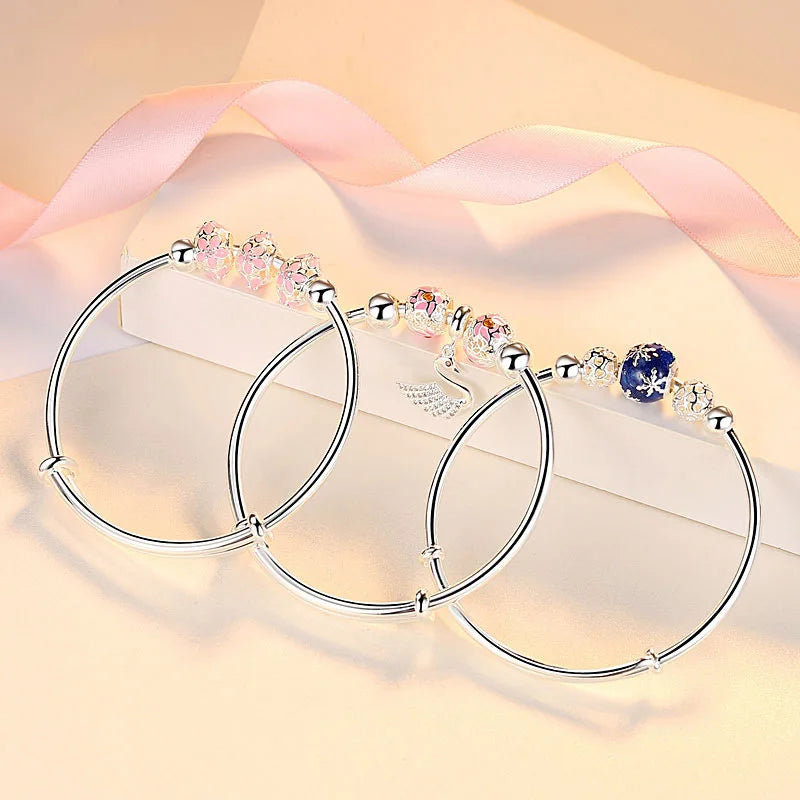 https://ae01.alicdn.com/kf/Sbbd3884214fc4db0b8aa4c8319684e07c/Silver-Color-Round-Lucky-Bead-Sakura-Snowflake-Dreamcatcher-Charm-bracelets-Bangle-for-women-bracelet-Elegant-love.jpg