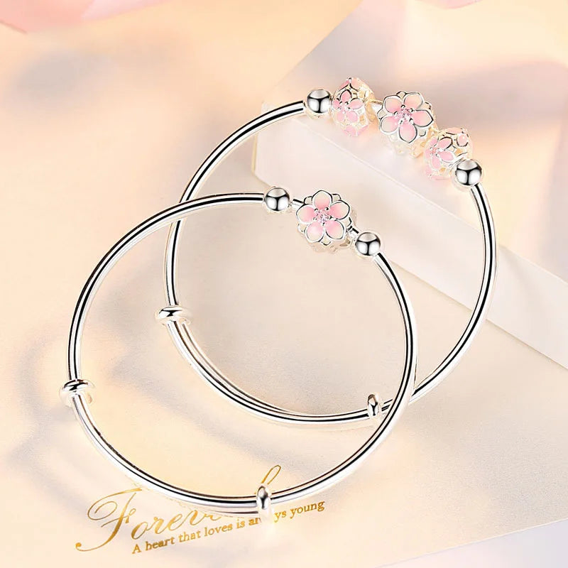 https://ae01.alicdn.com/kf/Sd35ea82c39144f9ca87dfe8883af003dd/Silver-Color-Round-Lucky-Bead-Sakura-Snowflake-Dreamcatcher-Charm-bracelets-Bangle-for-women-bracelet-Elegant-love.jpg
