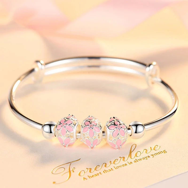https://ae01.alicdn.com/kf/S3dedca811392462f9b77eee62a36a482w/Silver-Color-Round-Lucky-Bead-Sakura-Snowflake-Dreamcatcher-Charm-bracelets-Bangle-for-women-bracelet-Elegant-love.jpg