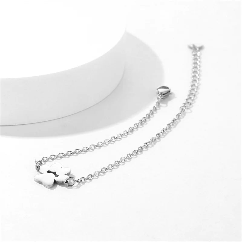 https://ae01.alicdn.com/kf/S23556a68b527418885304c89d37a98a9G/Stainless-Steel-Pet-Paw-Footprint-Bracelets-Shellhards-Cute-Animal-Tassut-Cat-Dog-Paw-Charm-Bracelet-for.jpg