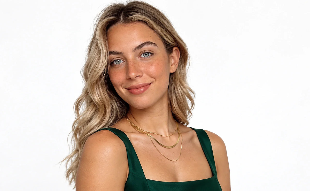 Auricelia jewelry worn in a distinct green outfit